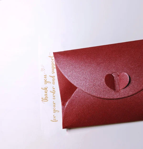 Red letter packaging containing earrings