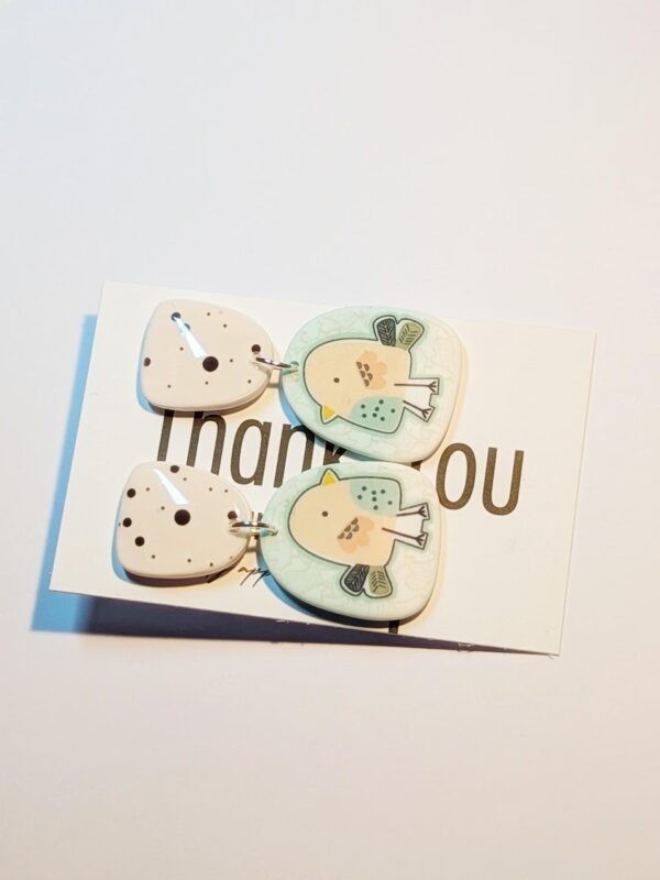Cute bird jewelry featuring a charming hand-painted design.