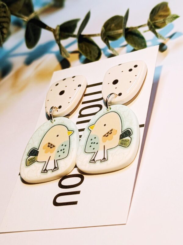 Handmade bird dangle earrings with polka dot top.