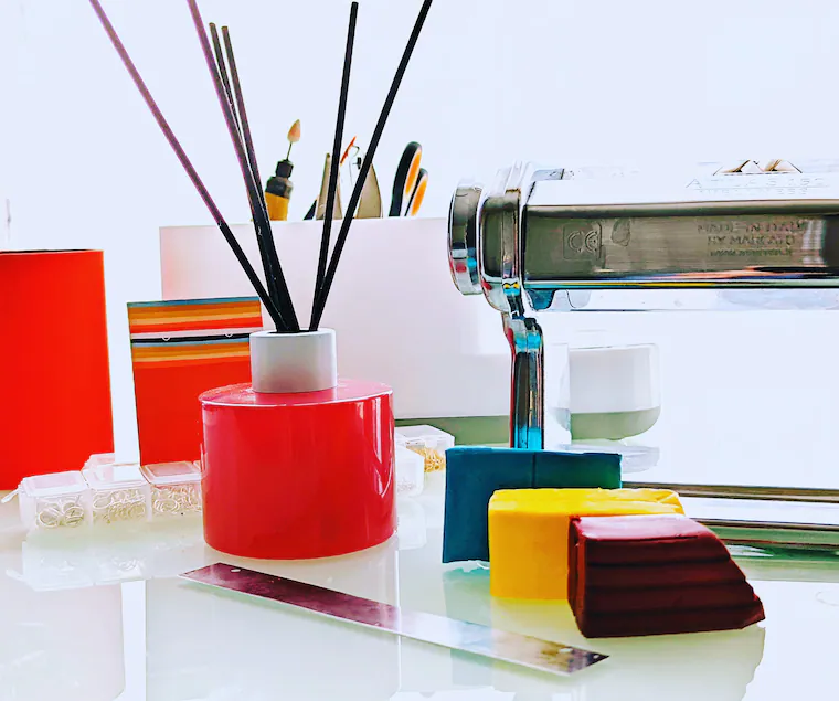 A table displaying a vibrant assortment of polymer clay and earring hooks, creating a lively and inviting atmosphere.