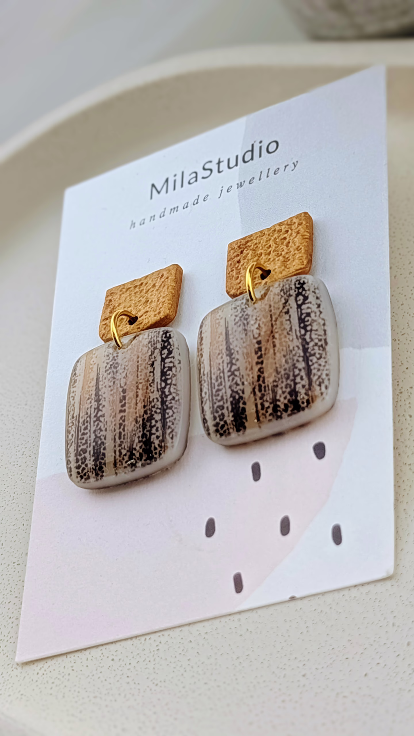 Side view of lightweight bark-patterned dangles showing the professional resin coating and slim, comfortable profile.